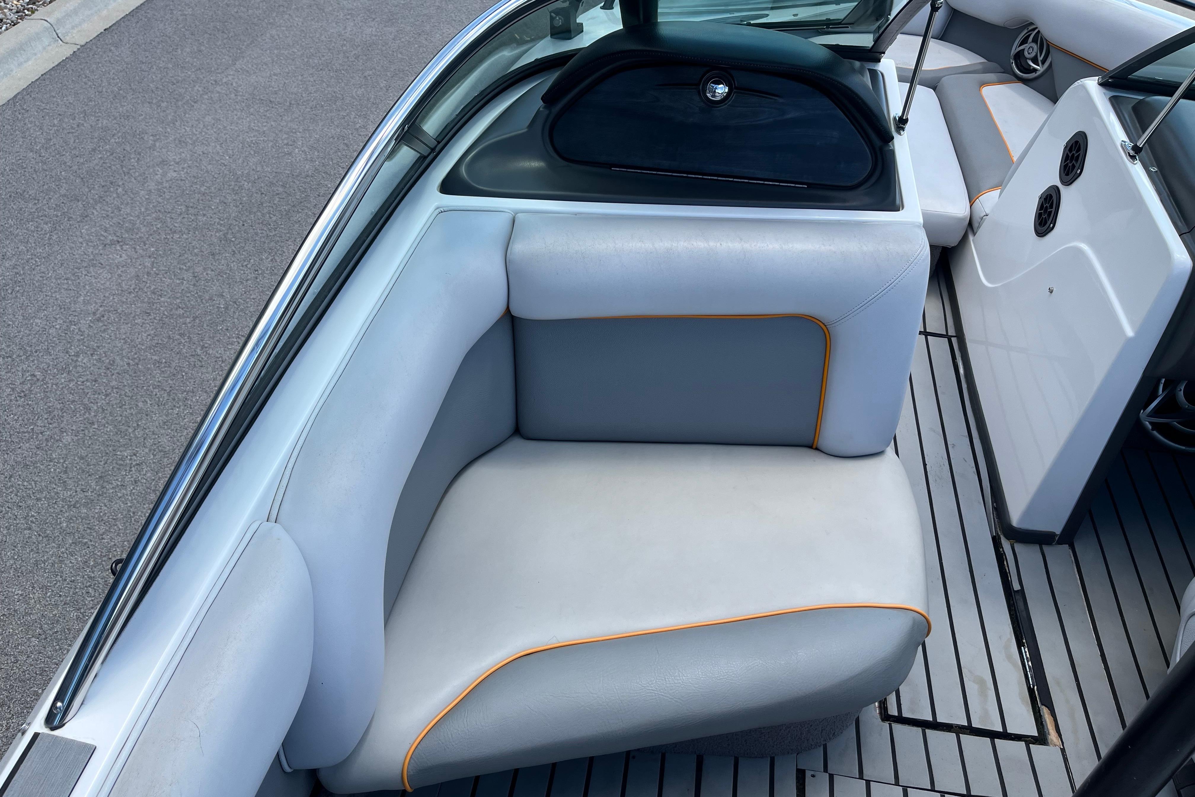 2008 Supra Launch 20 boat interior with gray seating and orange trim.
