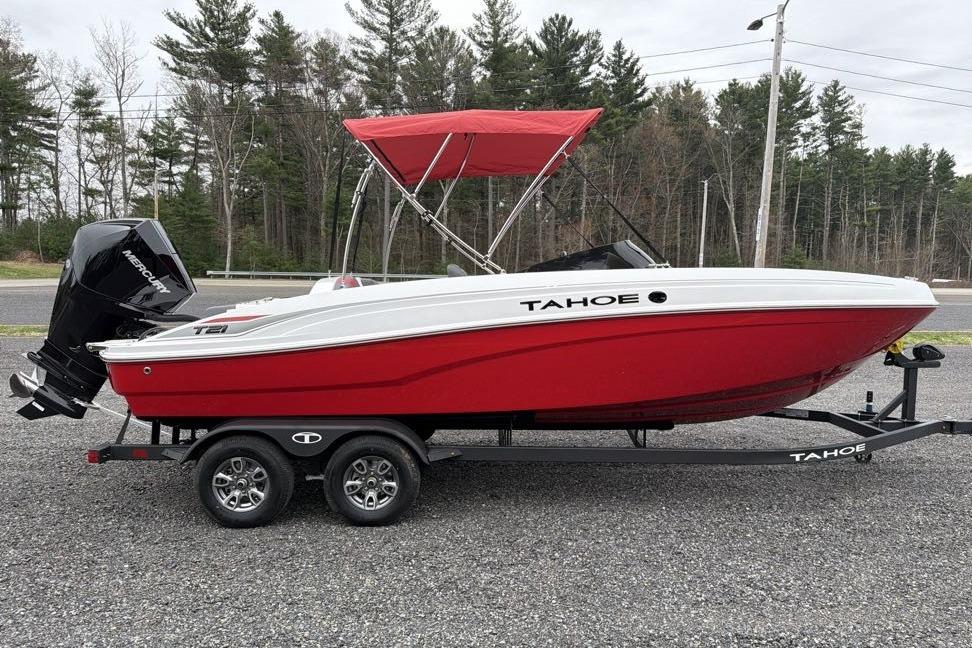 2026 Tahoe T21 boat with red hull and canopy on a trailer.