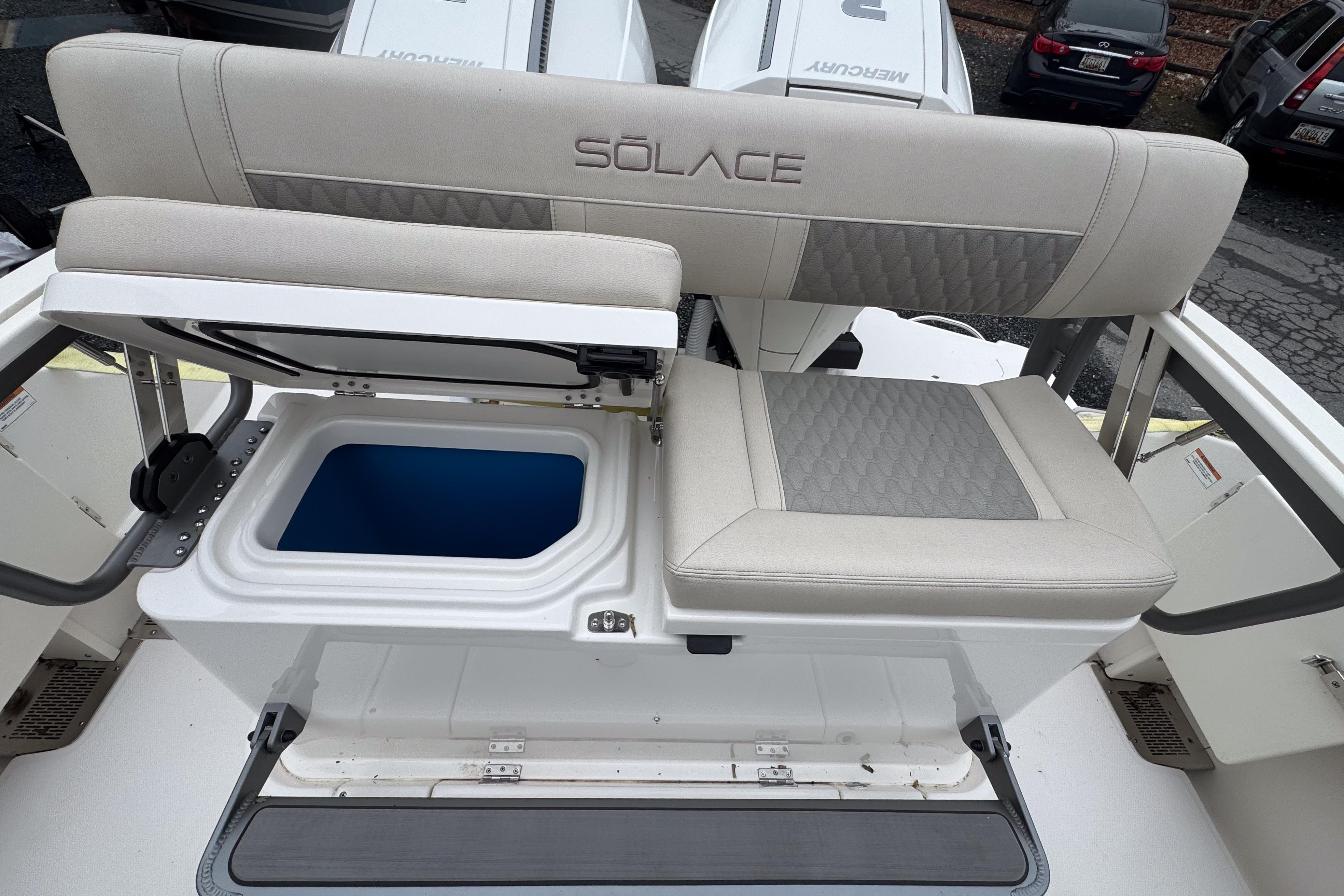 2025 Solace 30 HCS boat seat with storage compartment, featuring elegant upholstery design.