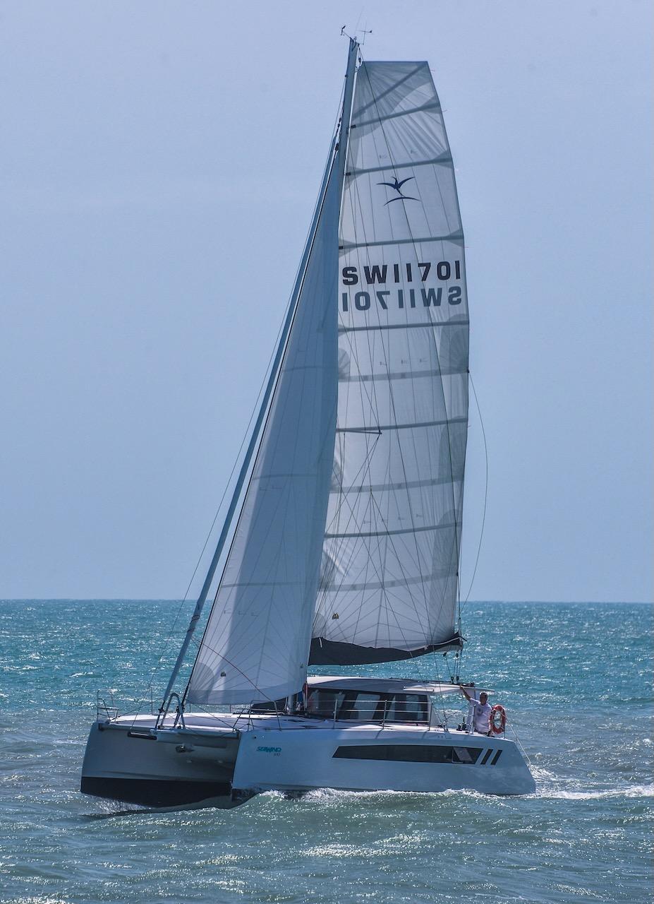 2025 Seawind 1170 catamaran sailing on open sea.