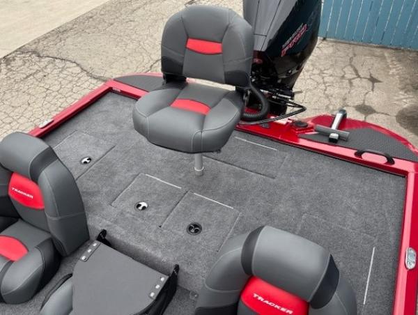 2025 Tracker Savage 215 boat interior with gray and red seating.