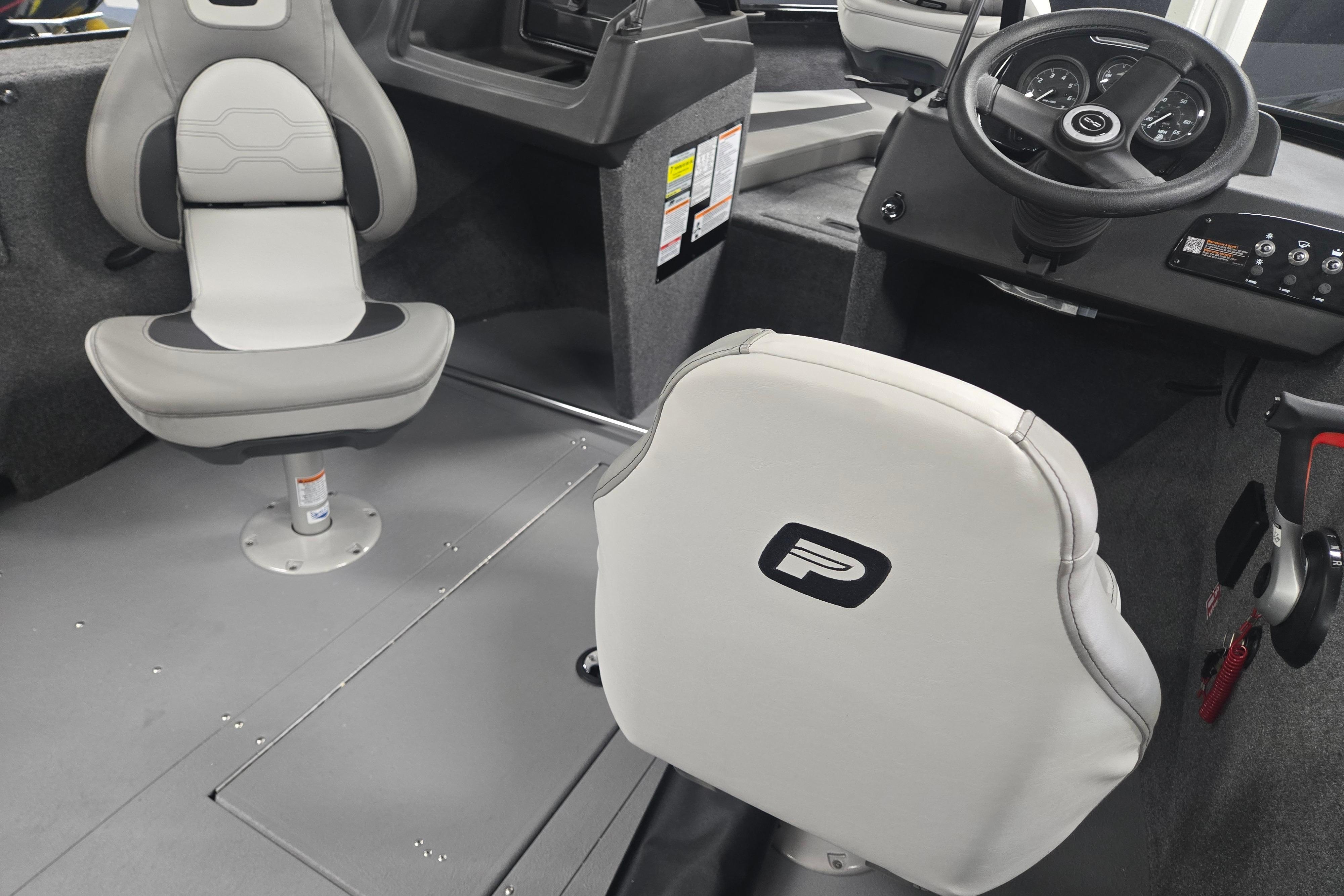 Interior of 2026 Princecraft Sport 175 MAX boat with steering wheel and seating.