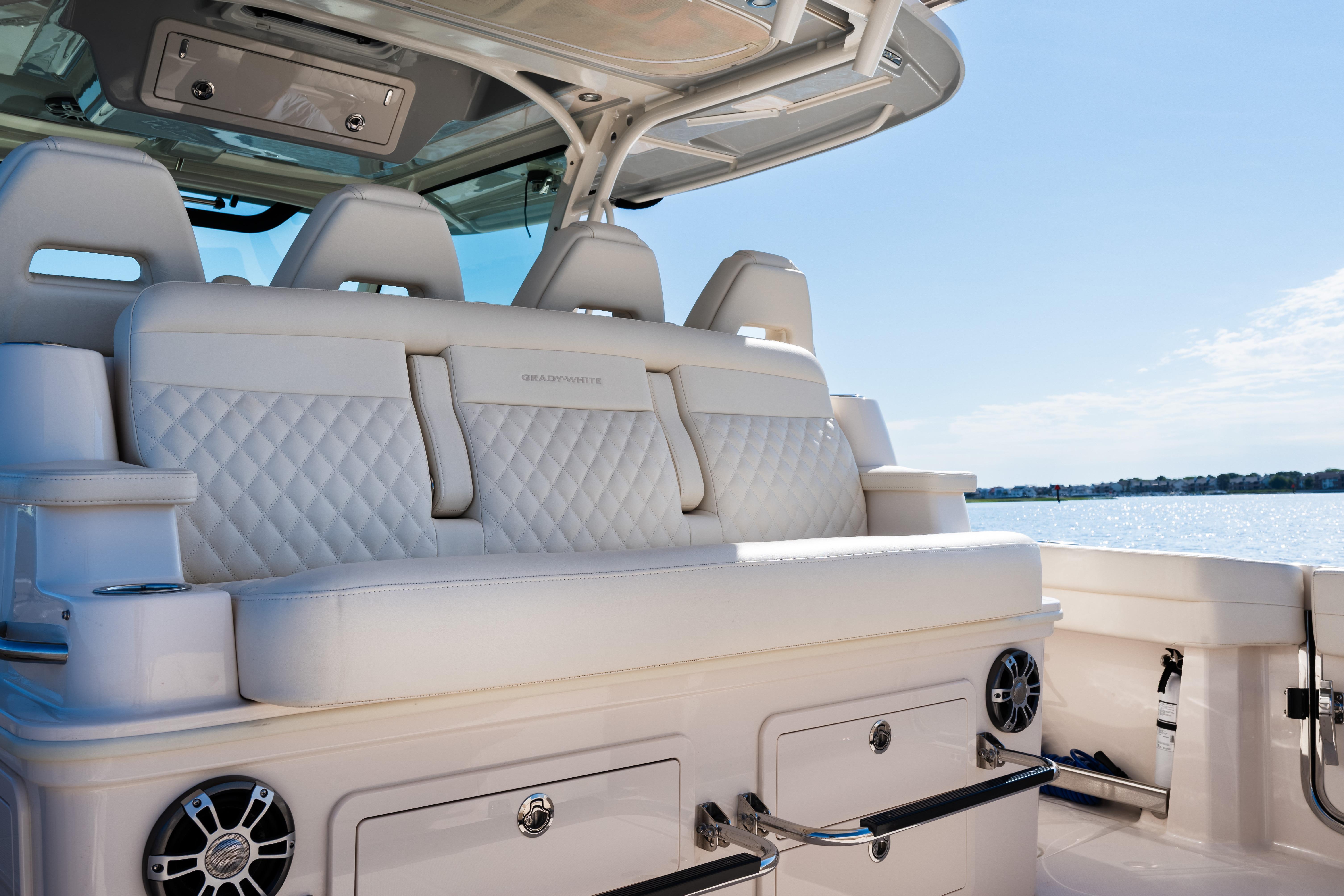 Luxurious seating on the 2025 Grady-White Canyon 386 boat, featuring elegant design and waterfront view.