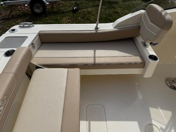 2025 Scout 215 Dorado boat interior with beige seating and cup holders.
