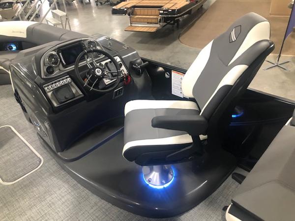 Interior of 2023 South Bay 525 RS 3.0 Arch boat with helm console.