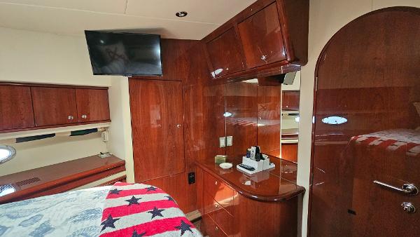 Luxurious 2005 Neptunus 56 Flybridge yacht interior with wood cabinetry and modern amenities.