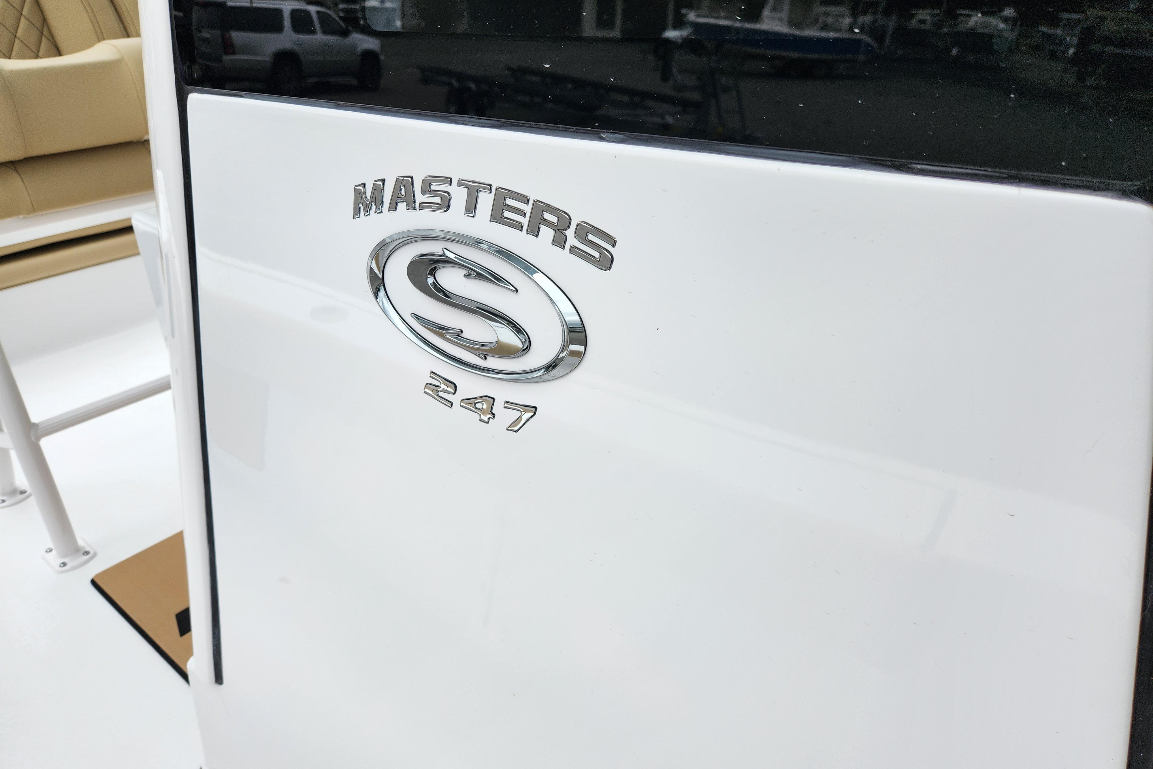 2026 Sportsman Masters 247 Bay Boat logo on white surface.