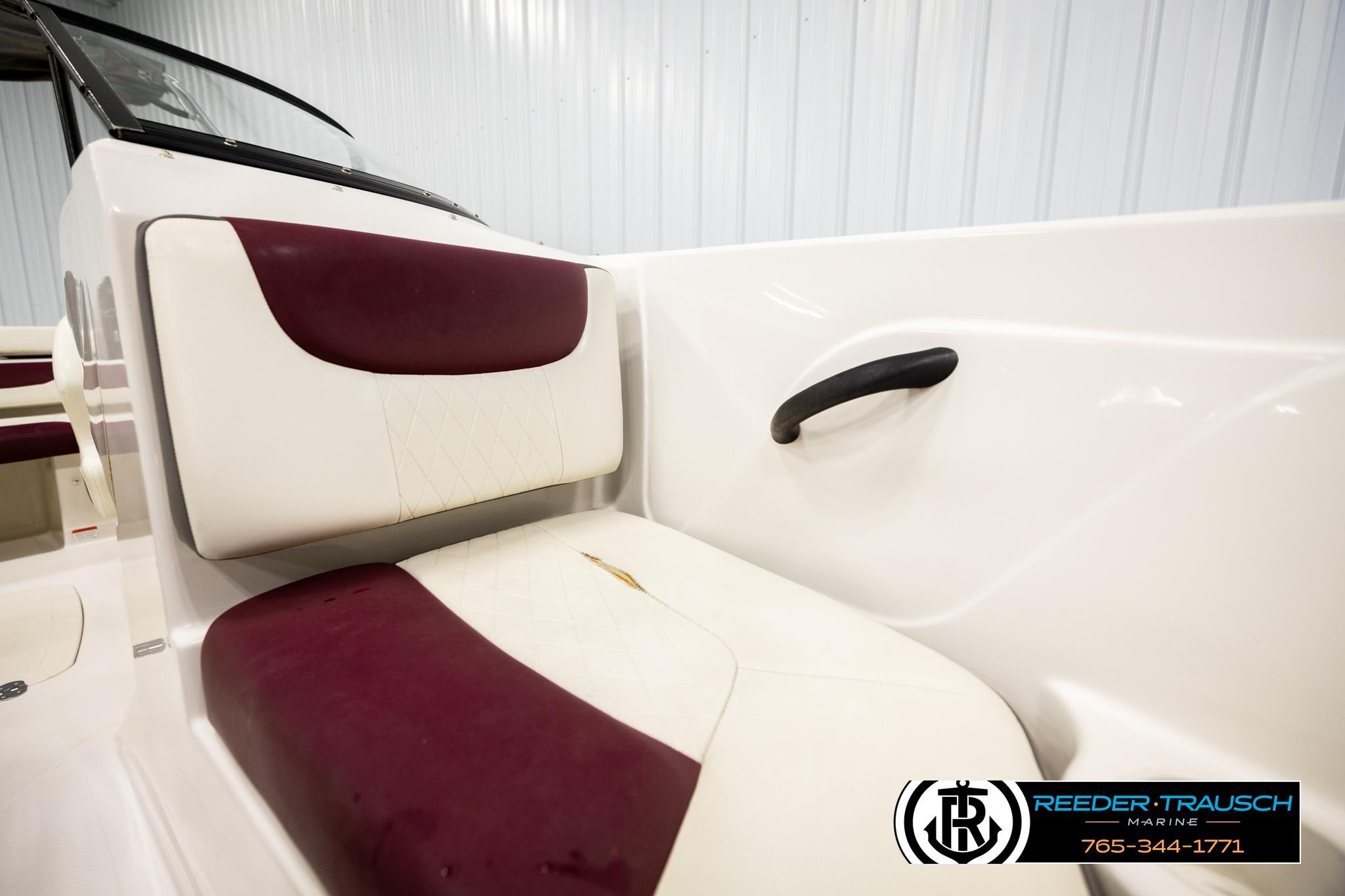 Interior seating of a 2016 Tahoe 450 TS boat with maroon and white upholstery.