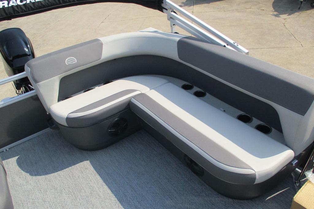 2026 Sun Tracker Bass Buggy 16 XL Select pontoon boat seating area with cup holders.