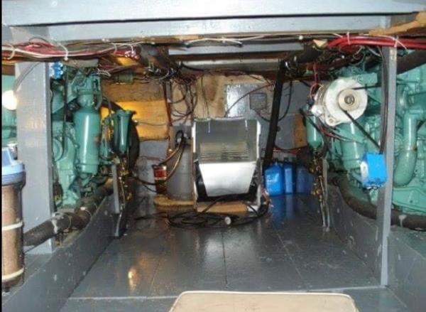 1951 Chris-Craft Catalina engine room with visible machinery and wiring.