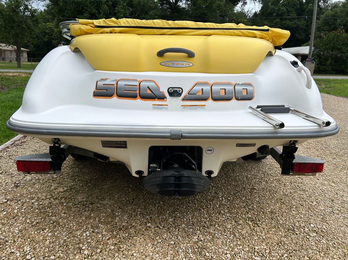 The image shows the rear of a 2004 Sea-Doo Sportster LE DI with a yellow cover.