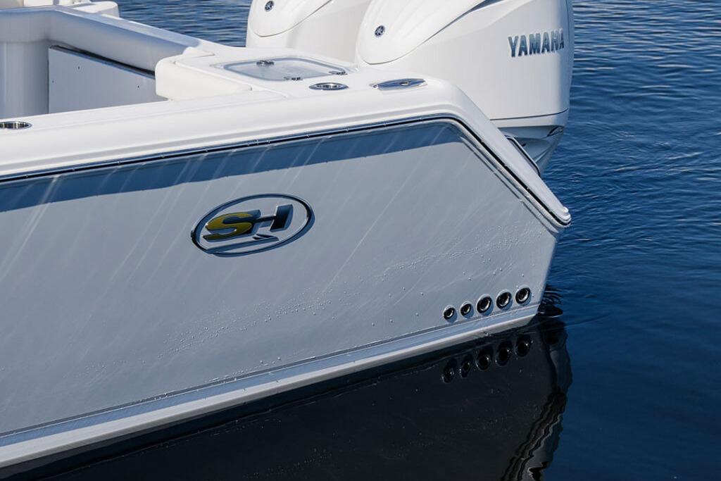 2026 Sea Hunt Gamefish 28 Coffin Box boat with Yamaha engines on water.