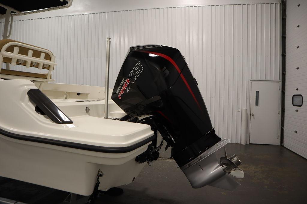 2026 Bayliner Trophy T20CC with Mercury Pro XS outboard motor in a showroom.