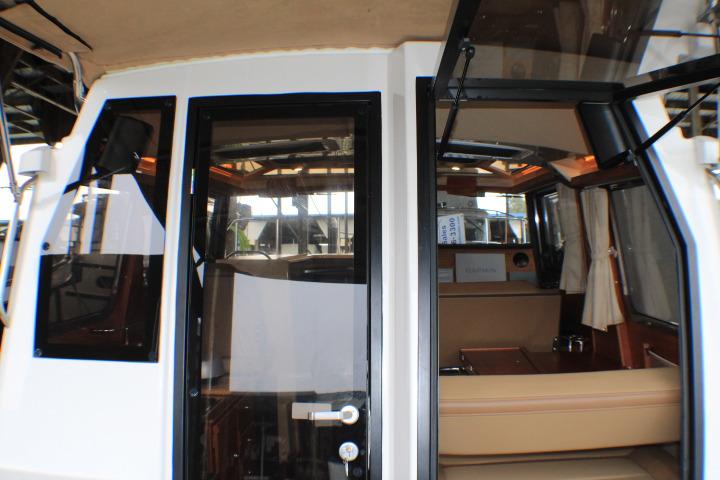 2020 Ranger Tugs R-27 interior view with open cabin door.