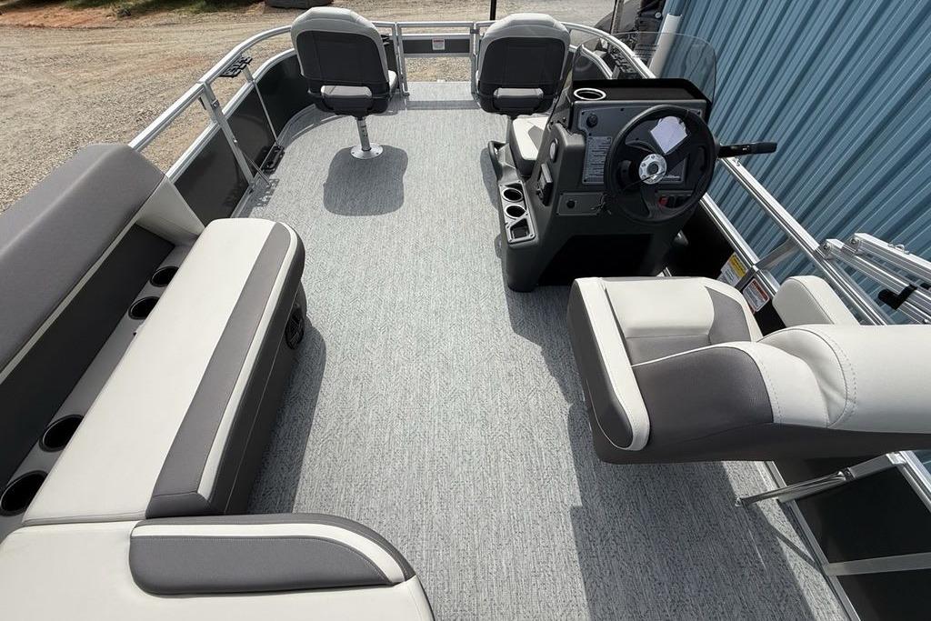 2026 Sun Tracker Bass Buggy 16 XL Select pontoon boat interior with seating and steering console.