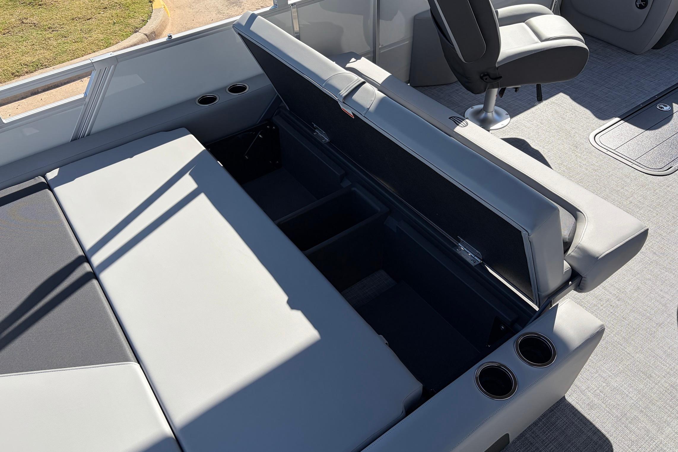 2026 Sun Tracker Party Barge 22 RF XP3 interior with open storage compartment and seating.