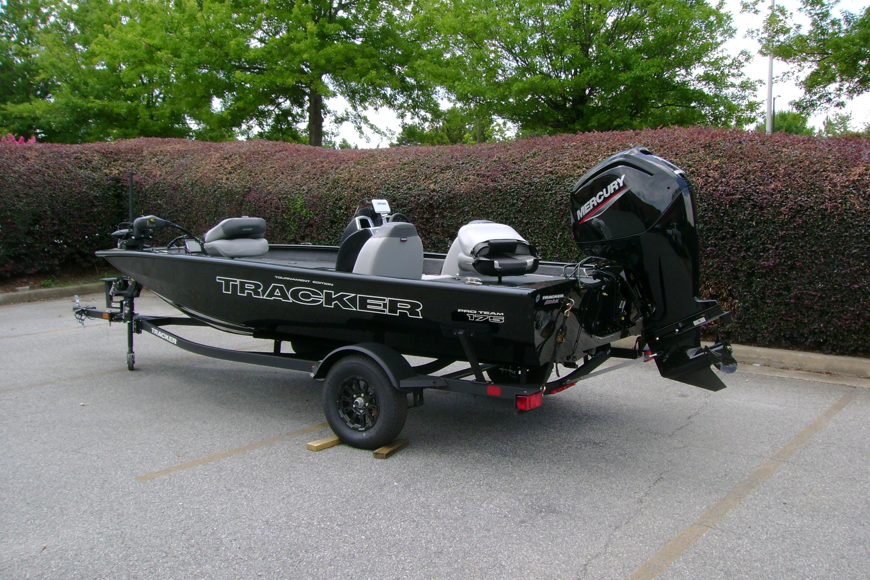 2026 Tracker Pro Team 175 boat with Mercury engine, parked outdoors.