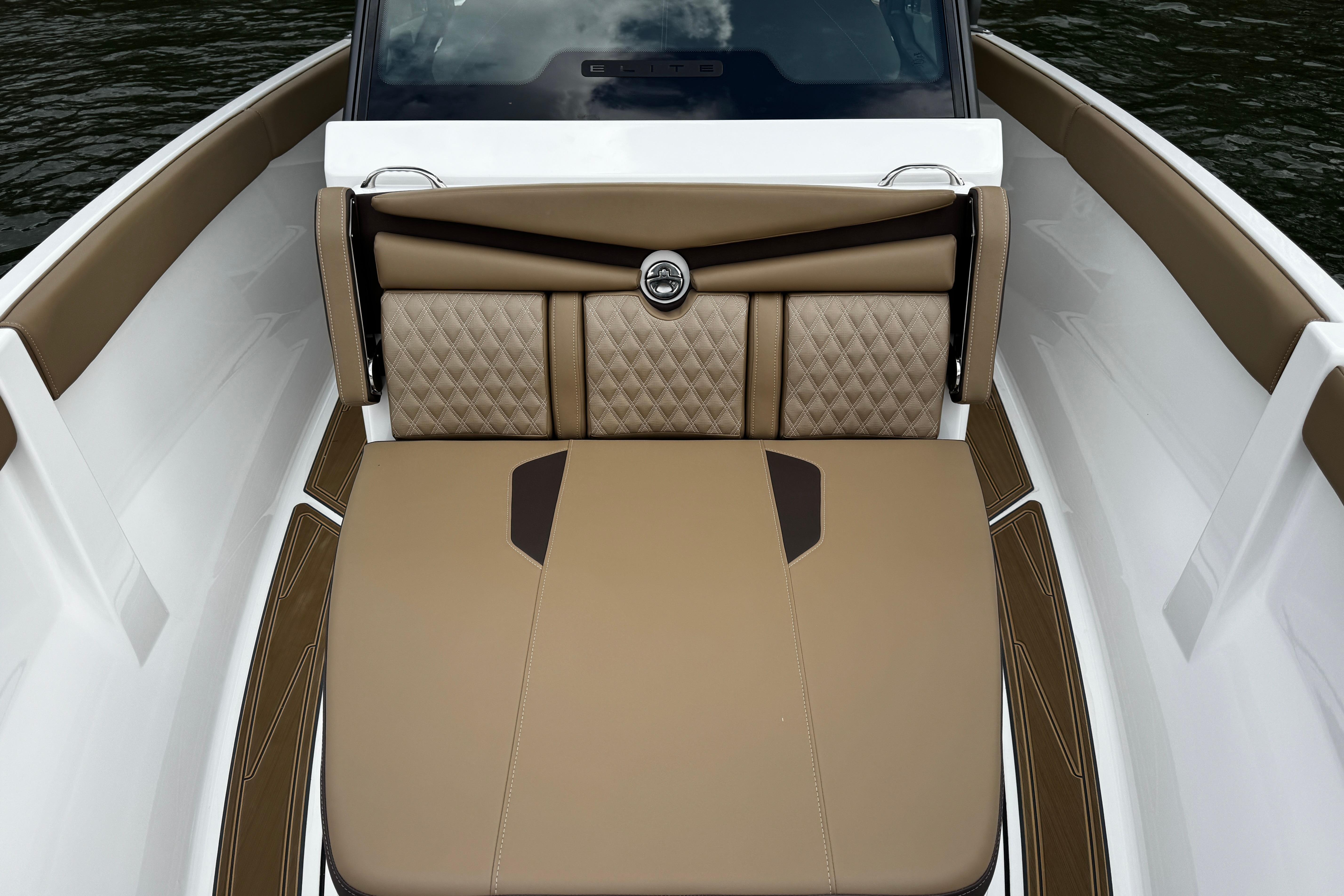 2026 Monterey Elite 25 OB boat interior with luxurious tan seating and diamond stitching.