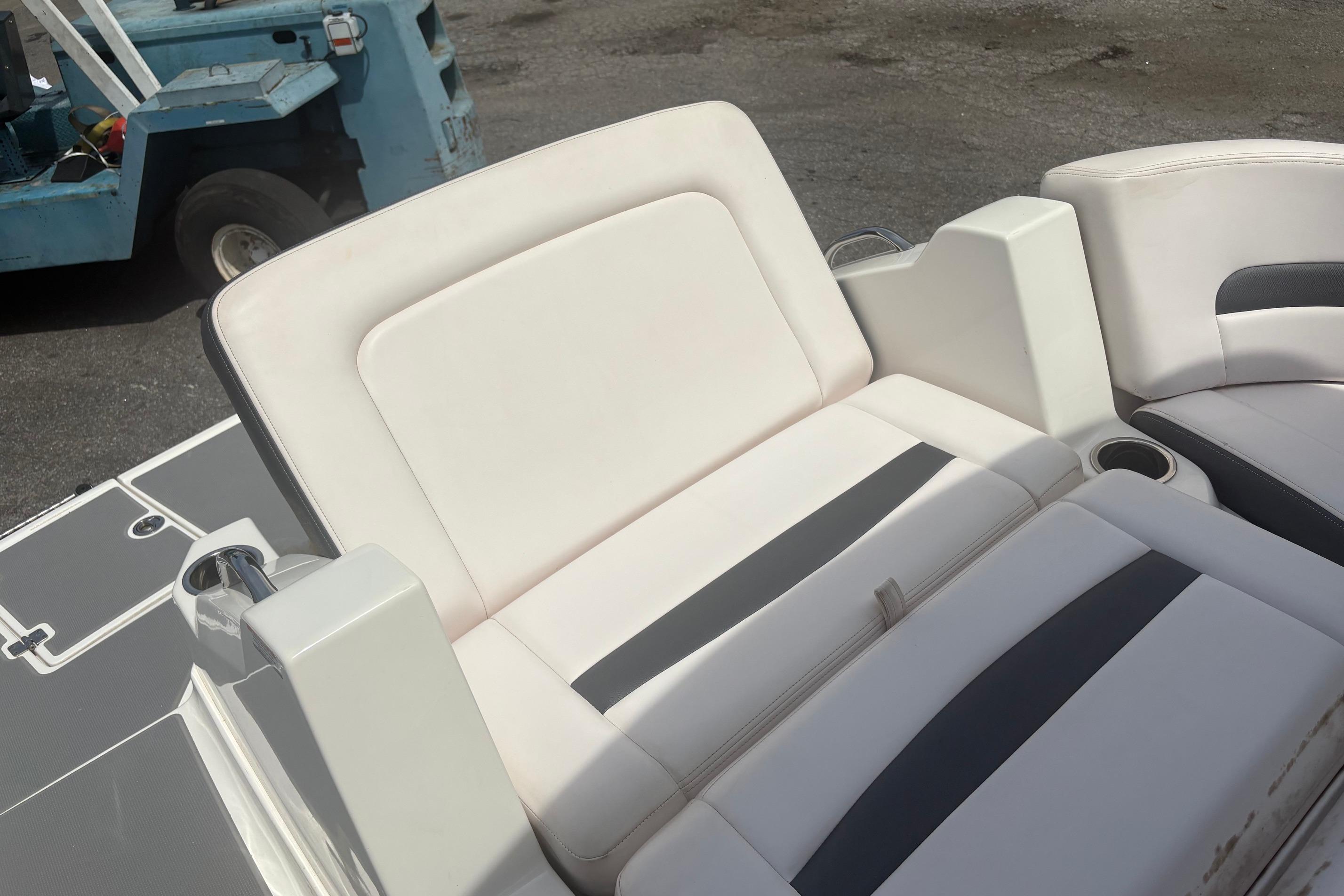2019 Chaparral 264 Sunesta boat interior with comfortable seating and cup holders.