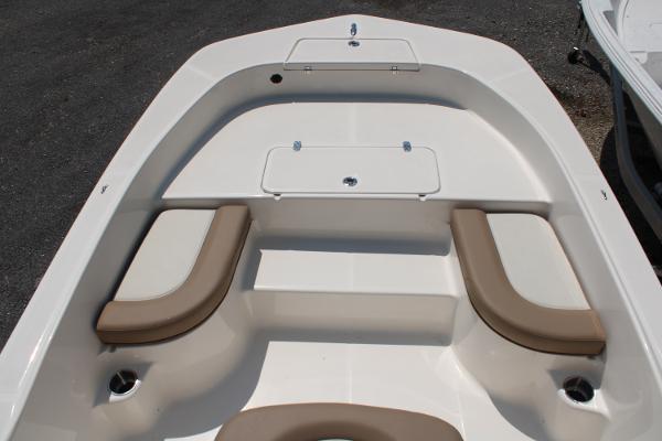 2023 Sundance DX20 boat interior with cushioned seating and storage compartments.