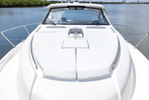 2025 Pursuit OS 405 boat on calm water, showcasing sleek design and spacious deck.
