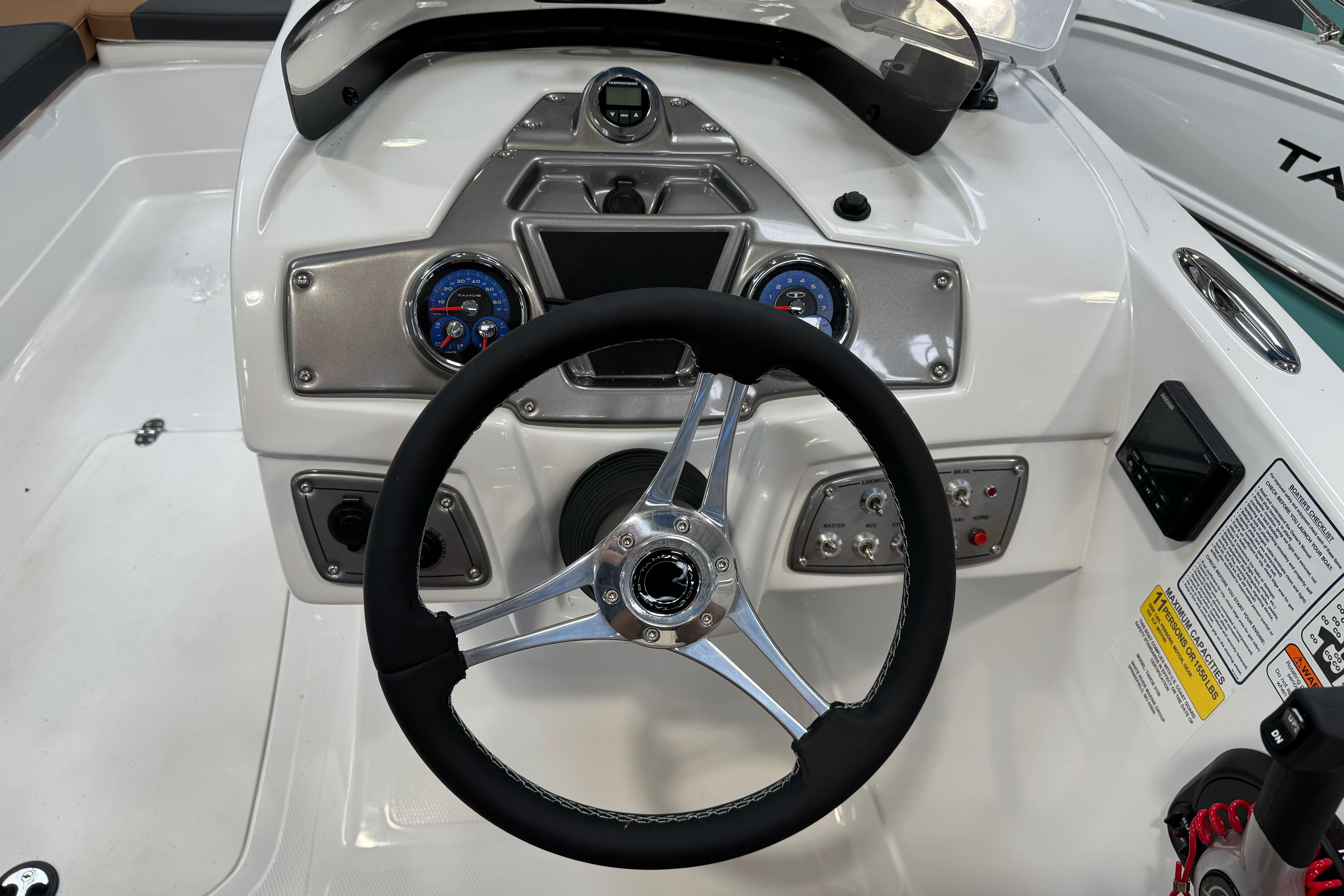 Steering console of 2026 Tahoe 2150 boat with modern controls and gauges.