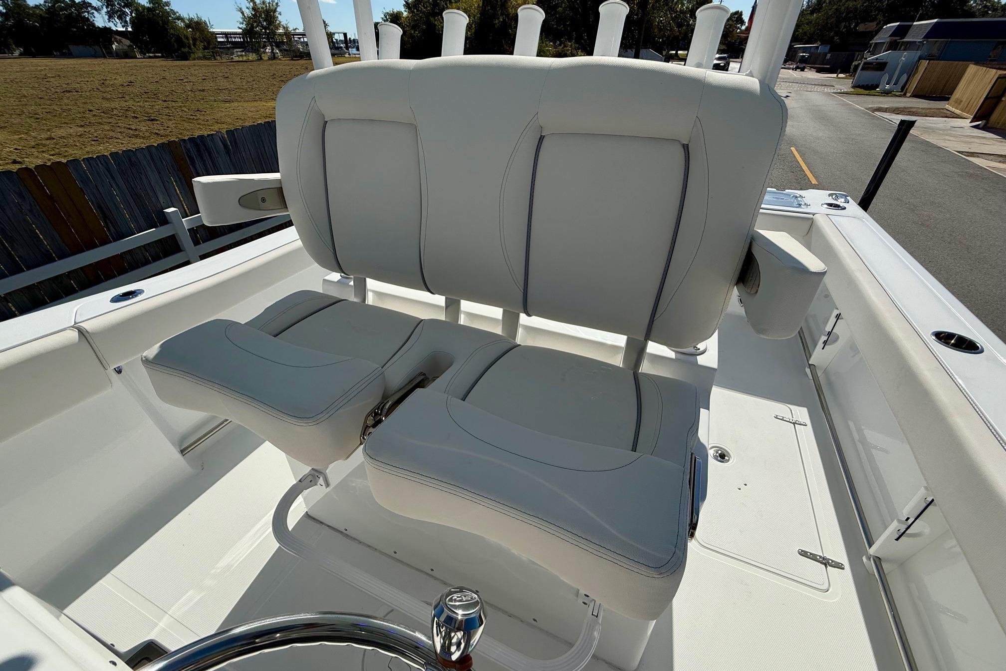 2026 Sea Hunt Gamefish 30 Coffin Box boat interior with cushioned seating.