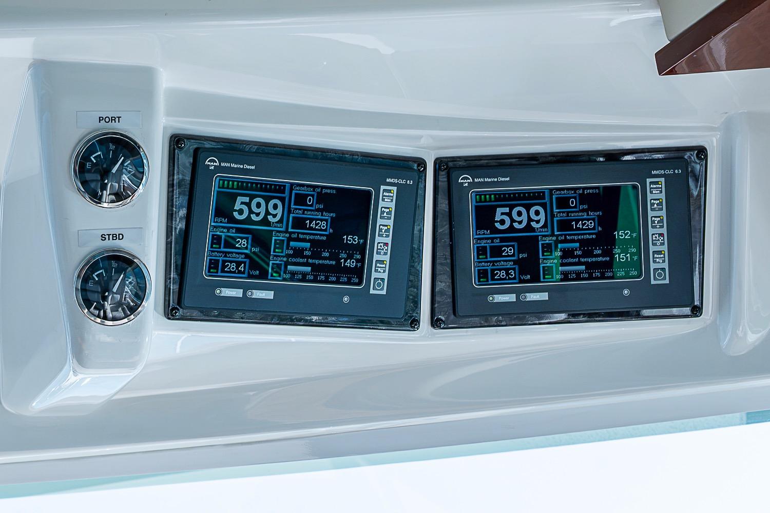 Dashboard of 2008 Sea Ray 60 Sundancer with dual digital displays and gauges.