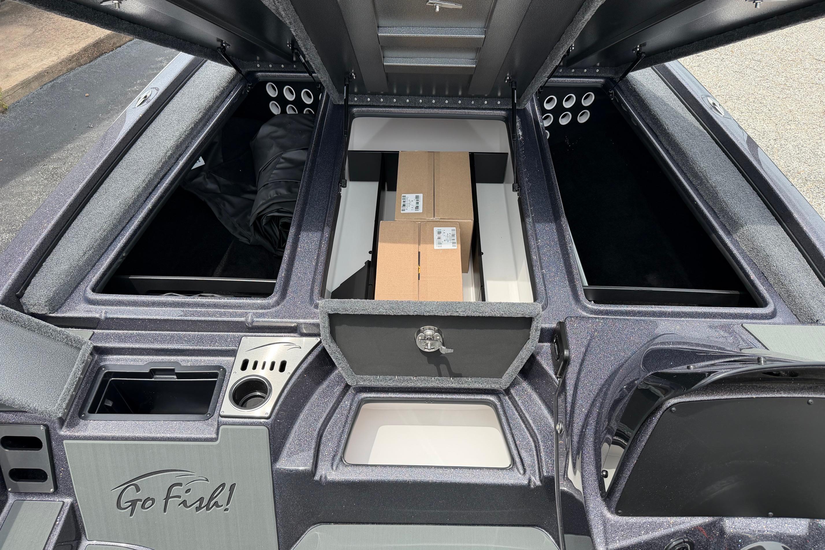 2027 Falcon Boats F215 interior storage compartments with "Go Fish!" branding.