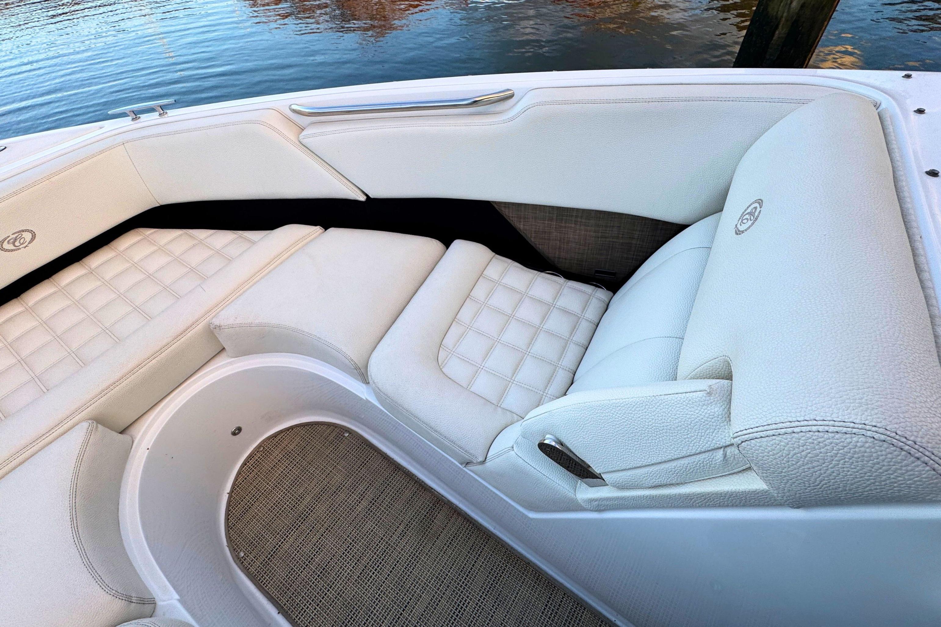 Luxurious seating on a 2019 Cobalt R3 boat, featuring white upholstery and elegant design.