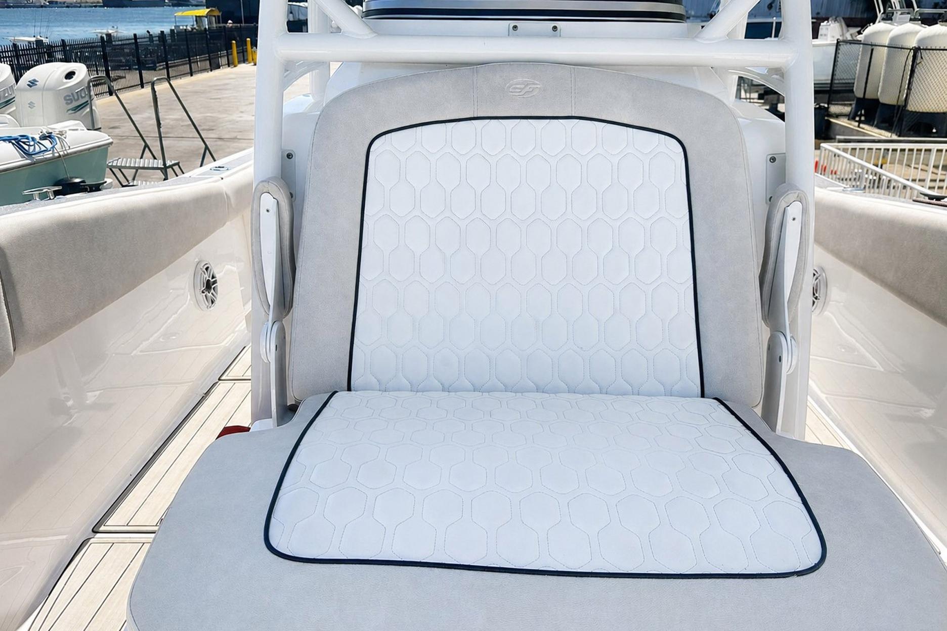 White cushioned seat on a 2002 Sea Fox 228 Commander boat.