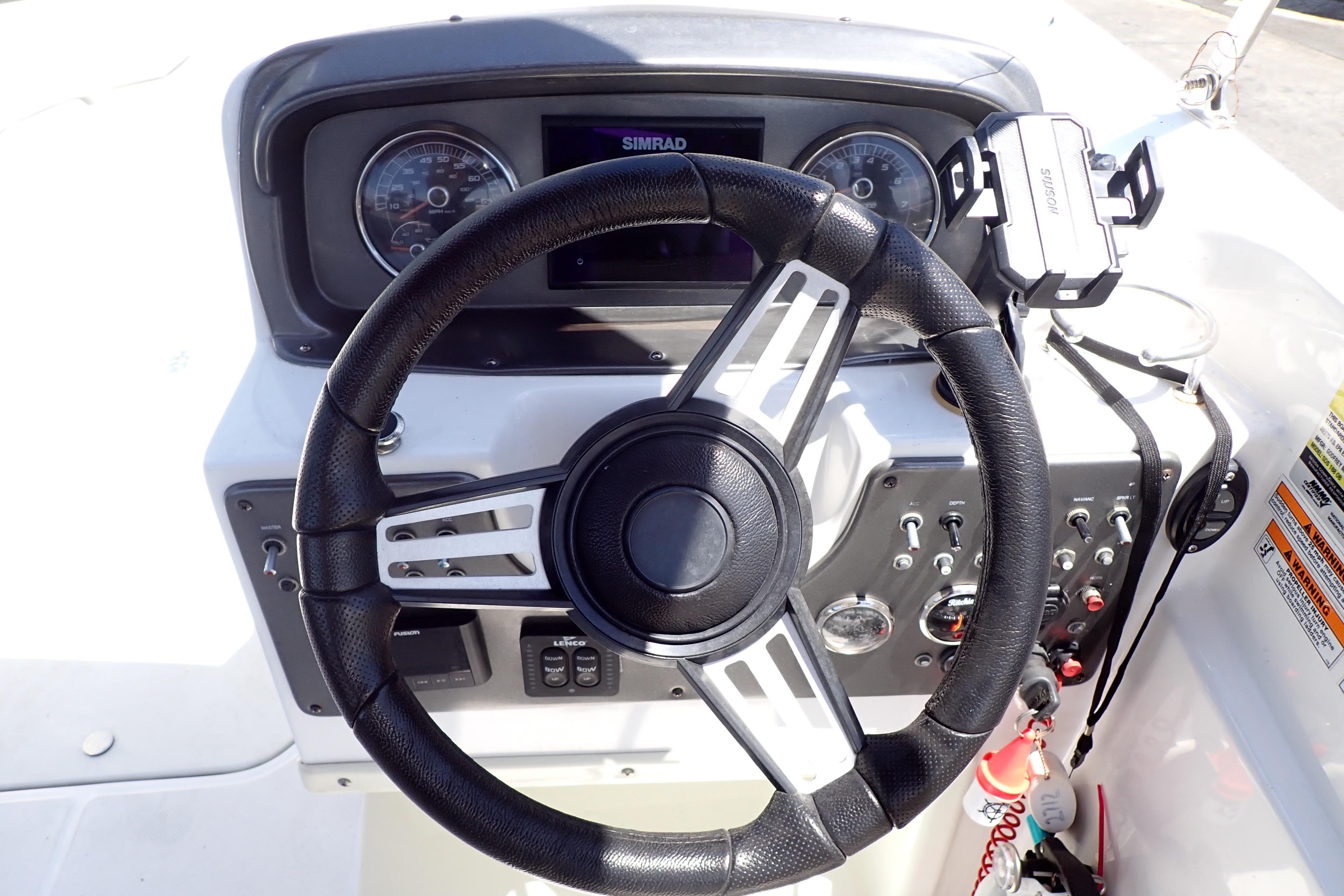 2021 Hurricane SunDeck Sport 185 OB boat dashboard with steering wheel and controls.