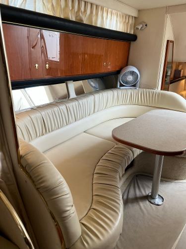 Interior of 2001 Sea Ray 340 Sundancer with leather seating area.