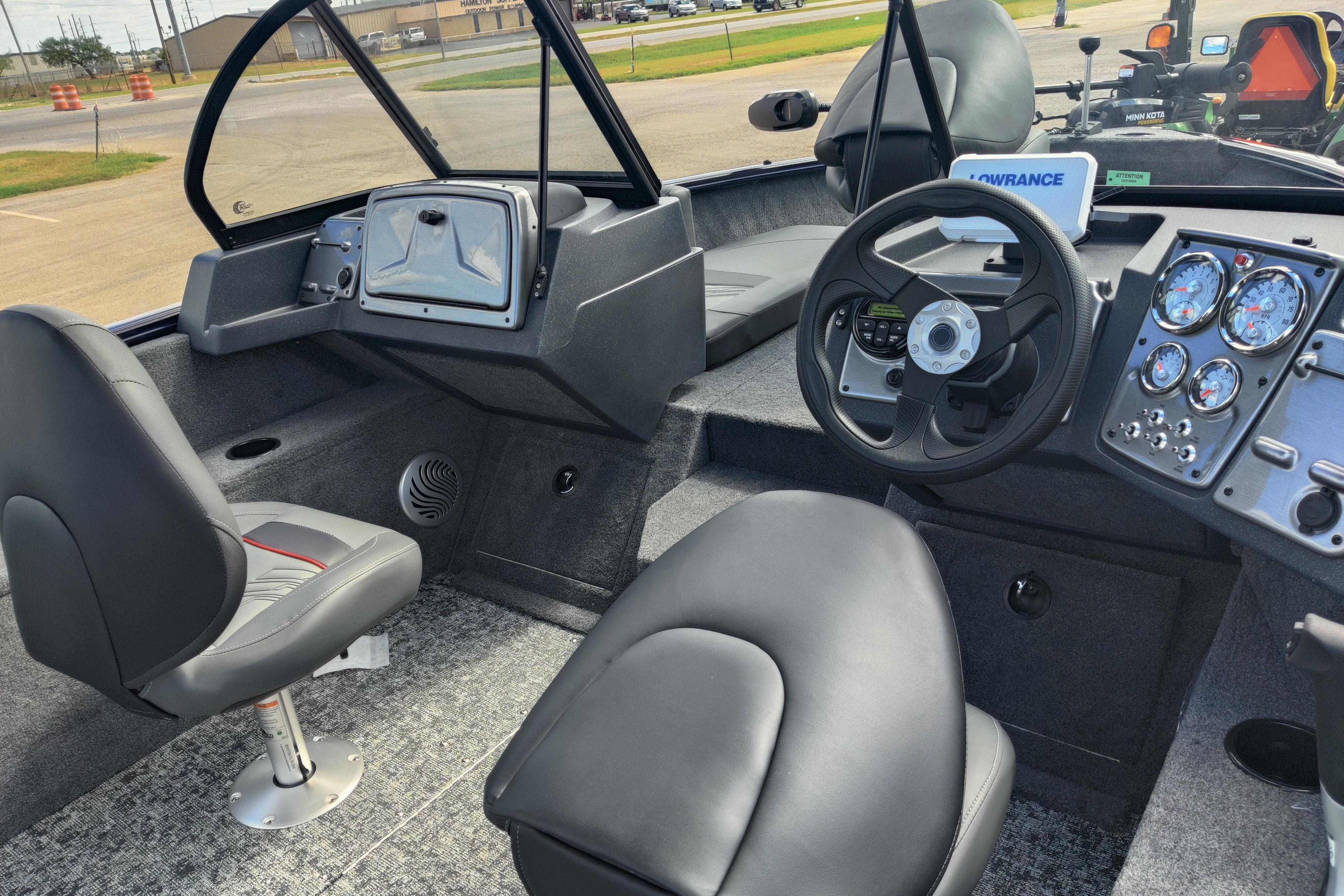 2026 Tracker Pro Guide V-175 Combo boat interior with steering wheel and dashboard controls.