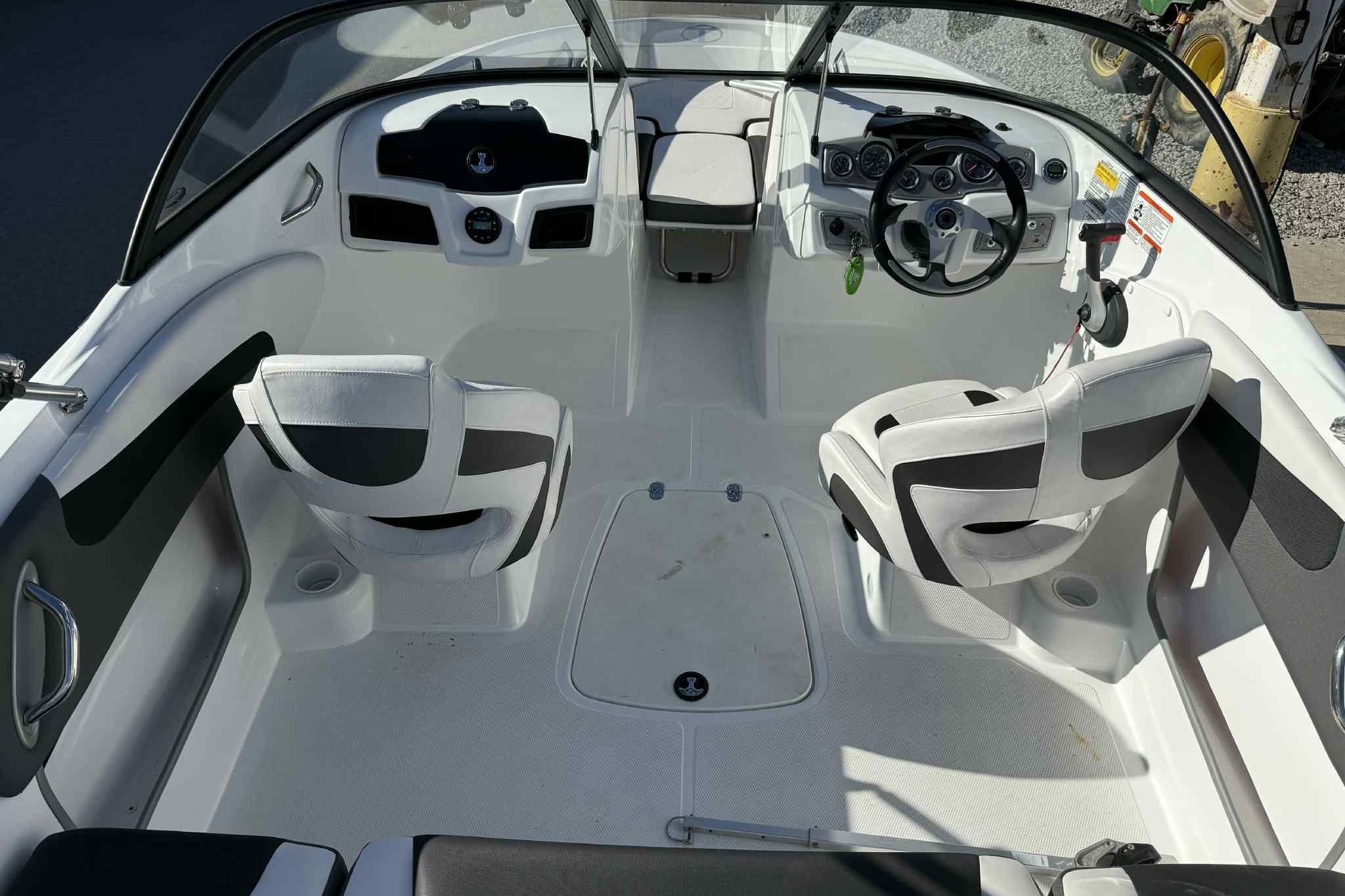 Interior of 2021 Tahoe 550 TS boat with modern seating and steering console.