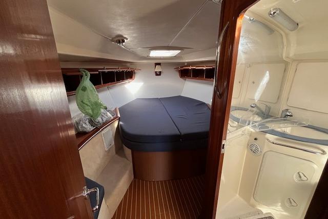 Interior cabin of 2003 Bavaria 44 yacht with bed and bathroom.