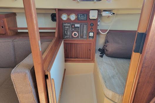 NAV STATION INCORPORATED INTO THE QUARTHER BERTH. NOTE NAV TABLE FOLDED AGAINST BULKHEAD