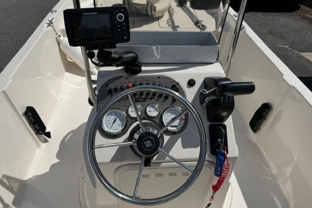 2023 Carolina Skiff 192 JLS boat console with steering wheel and navigation system.