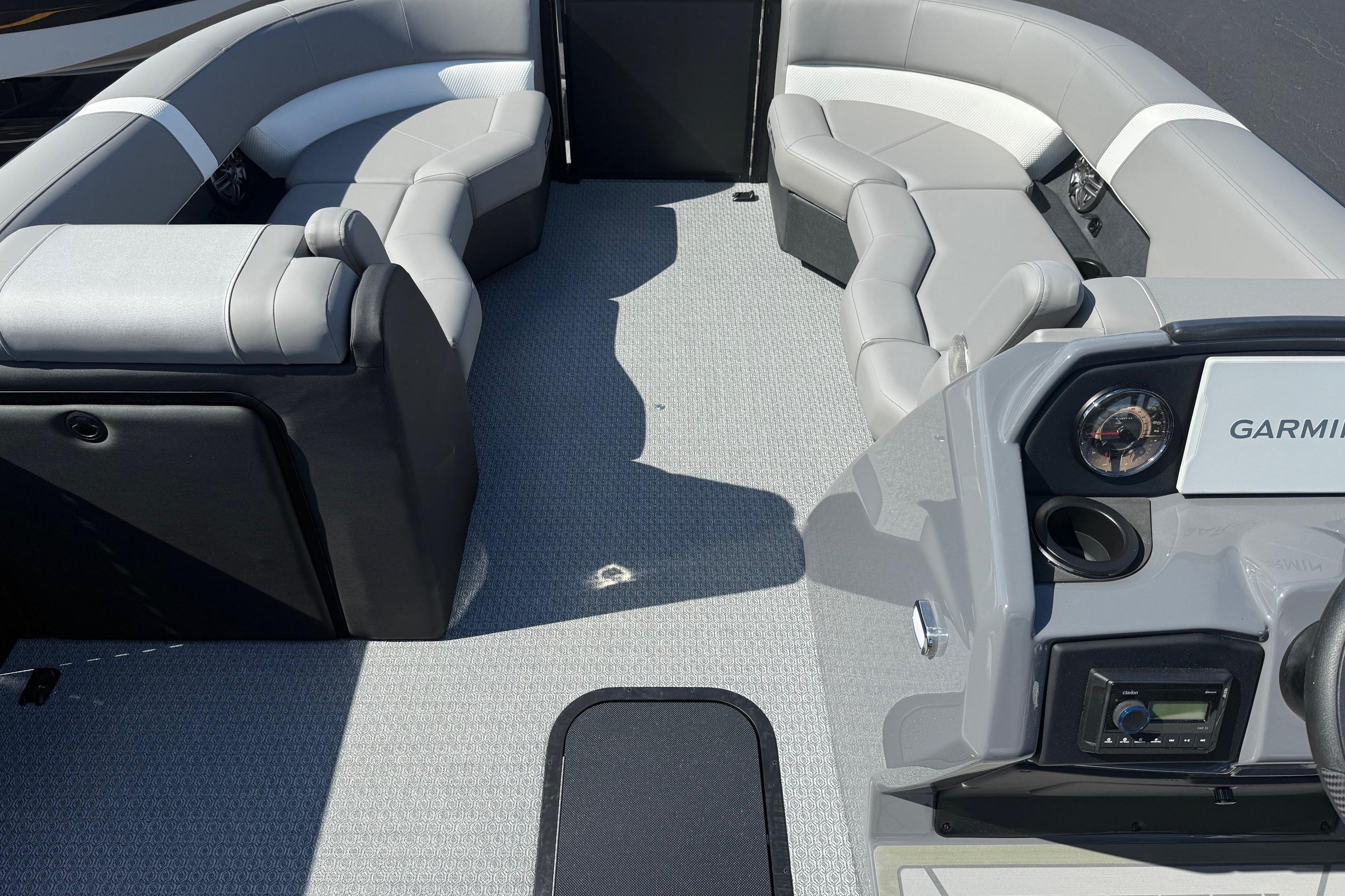 Interior of 2026 Evotti 521CS boat with modern seating and Garmin dashboard.