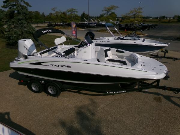 2024 Tahoe 2150 CC boat on trailer, parked outdoors.