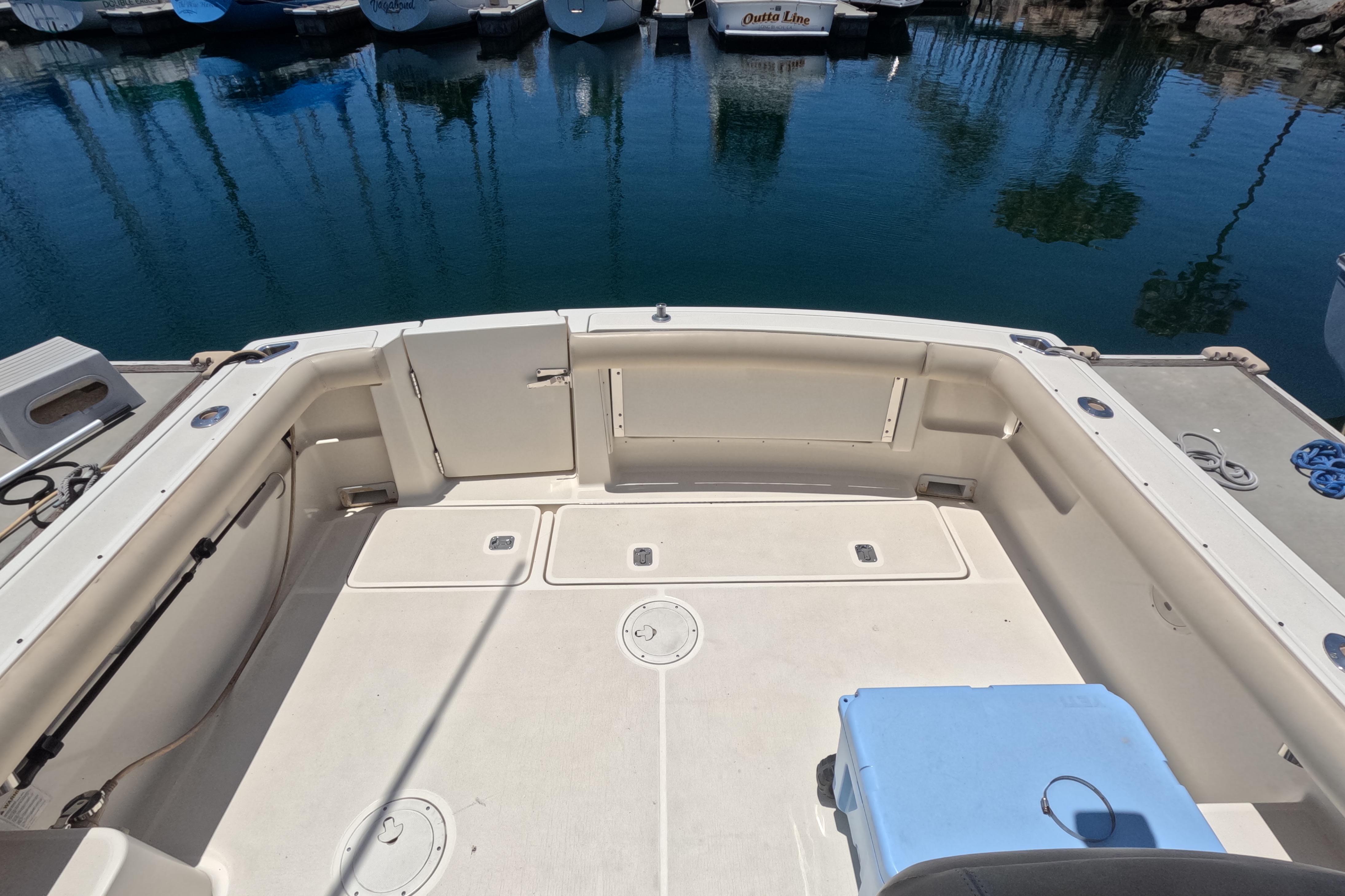 1995 Tiara Yachts 2900 Open boat deck, docked in a serene marina setting.