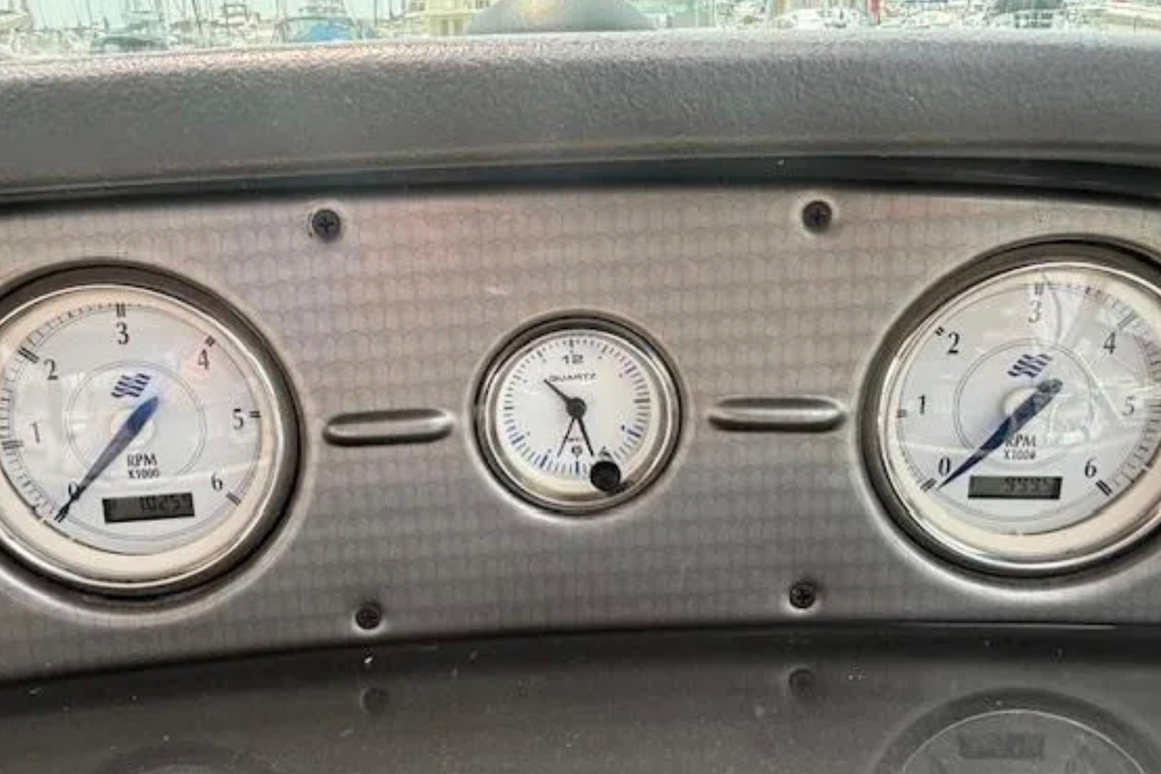 Dashboard of a 2007 Four Winns 378 Vista boat with RPM gauges.