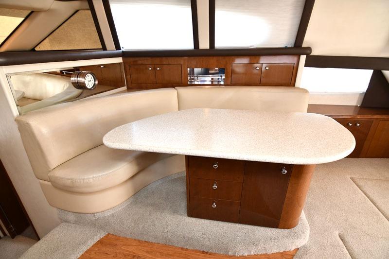 2008 Carver 43 Super Sport yacht interior with elegant dining area and wooden cabinetry.