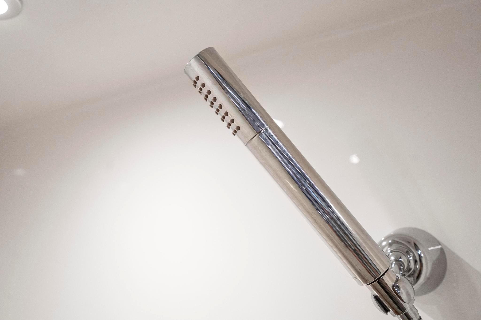 Modern chrome shower head in Tiara Yachts C49 Coupe, 2022 model.