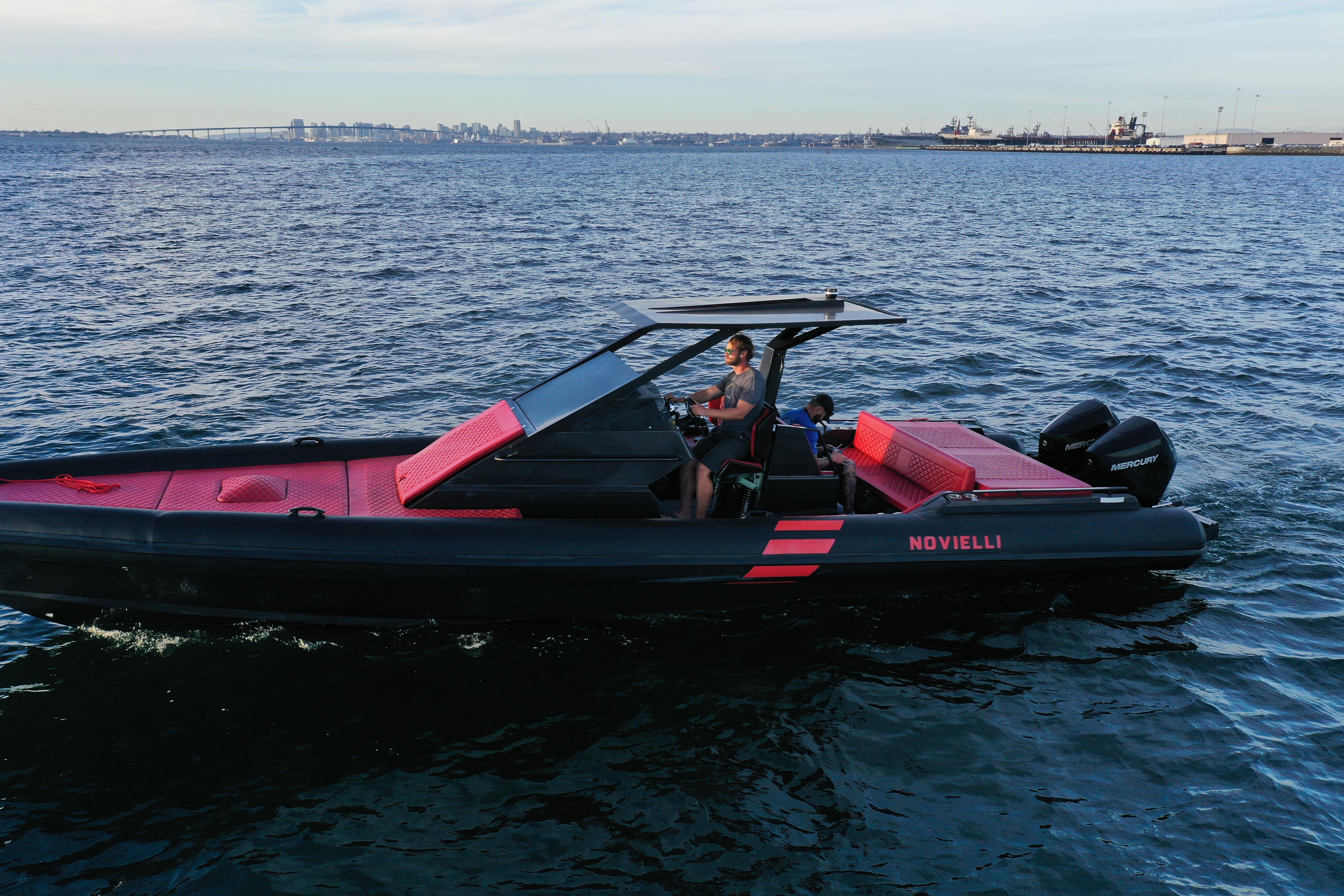 2023 Novielli Veloche 349 boat cruising on open water, featuring sleek design and vibrant red accents.