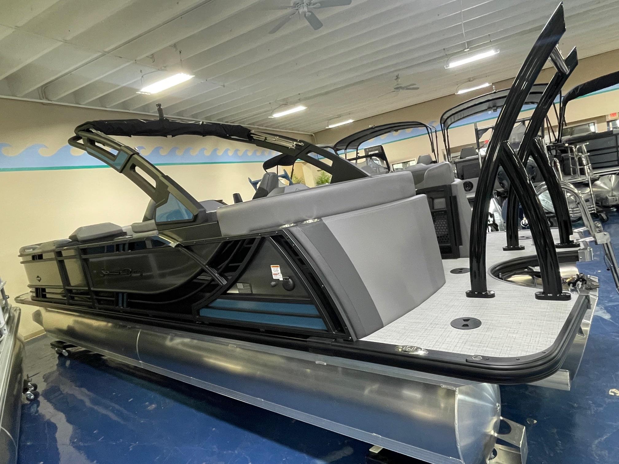 2026 South Bay 525 RS 3.0 Arch pontoon boat in showroom, featuring sleek design and modern amenities.