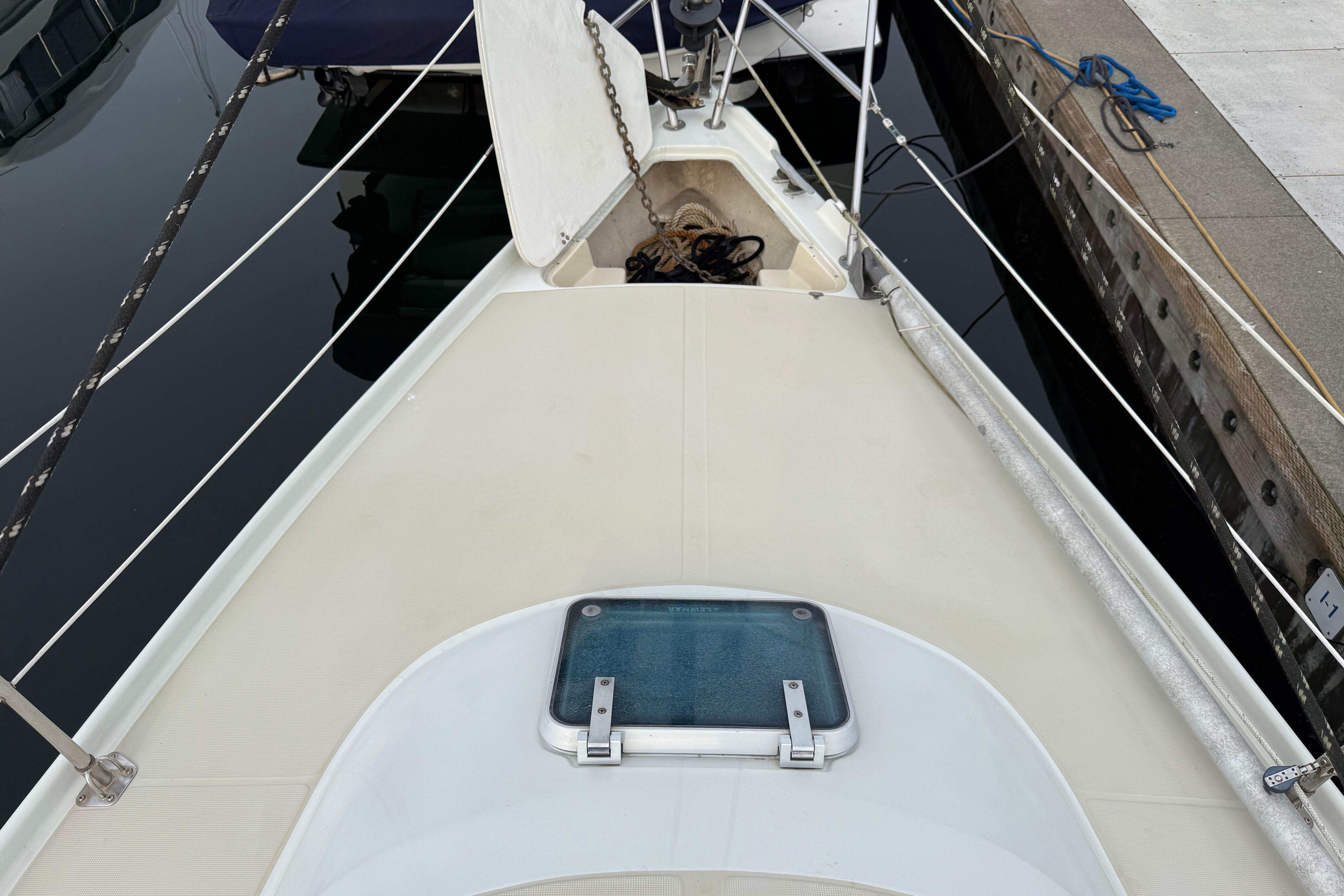 Deck view of 1988 Ericson 32-200 sailboat docked at marina.