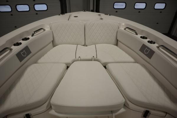 2025 Sea Fox 228 Commander boat with luxurious white seating and cup holders.