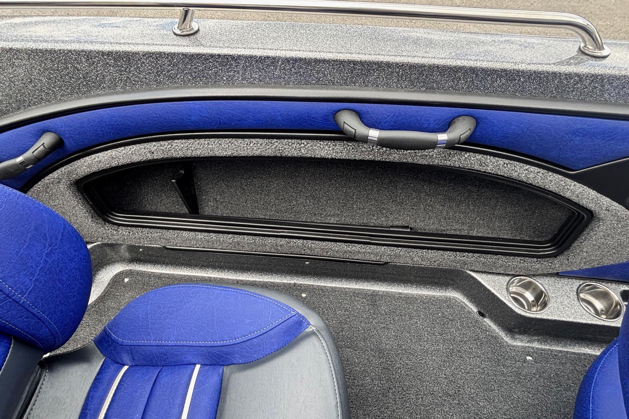 2026 Ranger 1880MS A Pack boat interior with blue seating and storage compartment.
