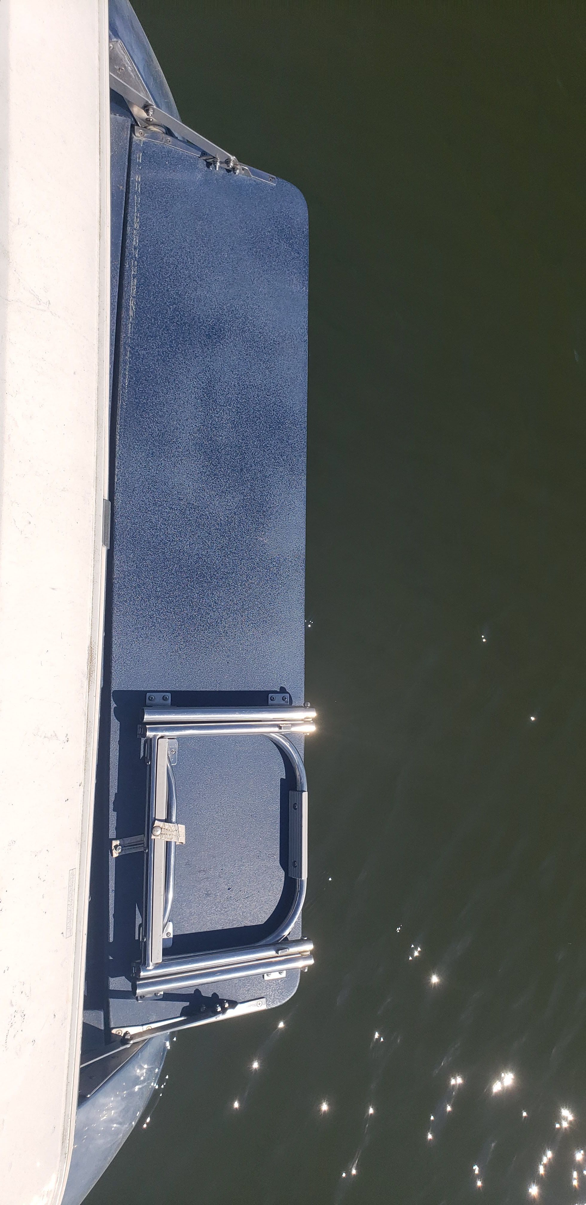 1993 Cobalt 272 boat with swim platform on water.